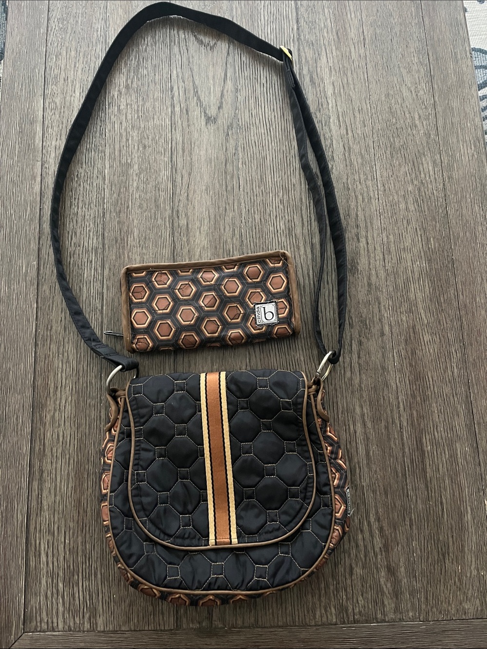 Black Quilted Crossbody Bag with Brown Trim and Striped Accent
